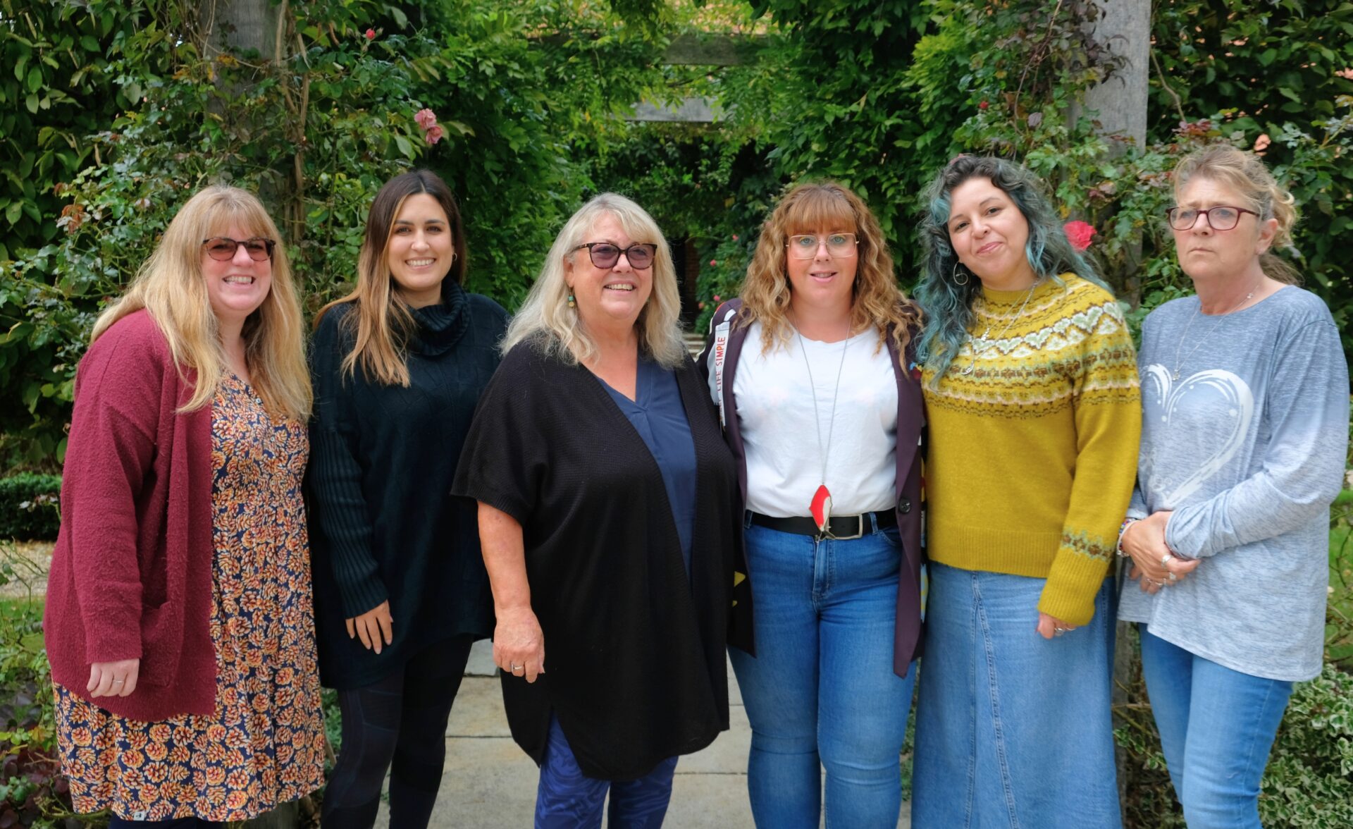 Southdown's Pathways Home team are standing outside and are smiling at the camera.