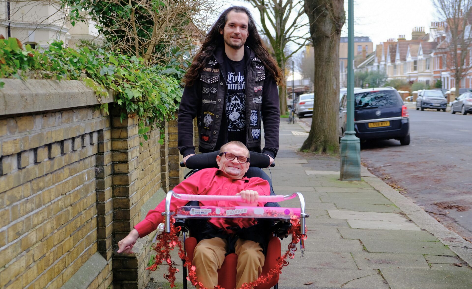 One of our clients is outside with his Support Worker.